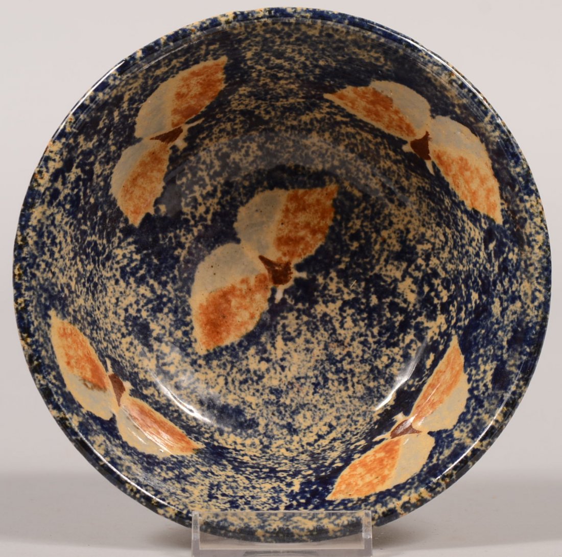 Left Handed Russel Henry Stoneware Bowl. Natural exteri: Left Handed Russel Henry Stoneware Bowl. Natural exterior, flared rim and with a blue sponged interior with two tone brown butterflies. Signed and dated: 3/'79 on bottom. 2 1/2"h. X 5 7/8"dia.