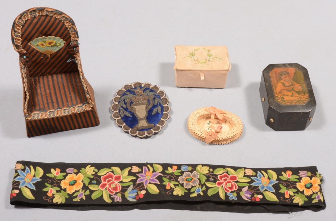 Five Piece Lot of Sewing Items. A fabric covered pasteb: Five Piece Lot of Sewing Items. A fabric covered pasteboard chair with lift lid seat compartment for notions, 7"h. X 4 1/2"w.; a pink grosgrain satin covered hinged lid box with small carved bone tool
