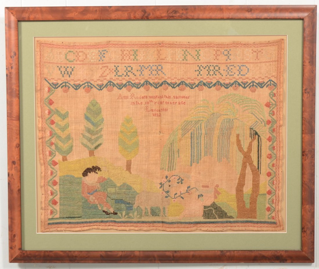 Framed Lancaster, PA. Sampler. Wool on linen with a cap: Framed Lancaster, PA. Sampler. Wool on linen with a capital alphabet and series of initials over "Ann Rogers worked this sampler in the 10th year of her age, Lancaster, 1822." Showing a willow tree al