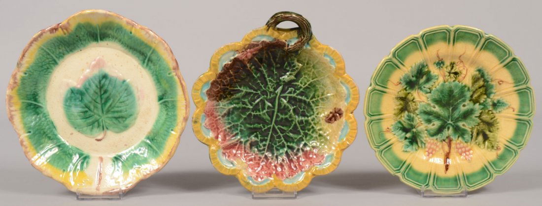 Three Small Majolica Dishes. Green, yellow and brown di: Three Small Majolica Dishes. Green, yellow and brown dish with scalloped rim and maple leaf on white center, 8"dia.; Fifteen panel bordered plate in green and yellow with grapes and leaves on center a