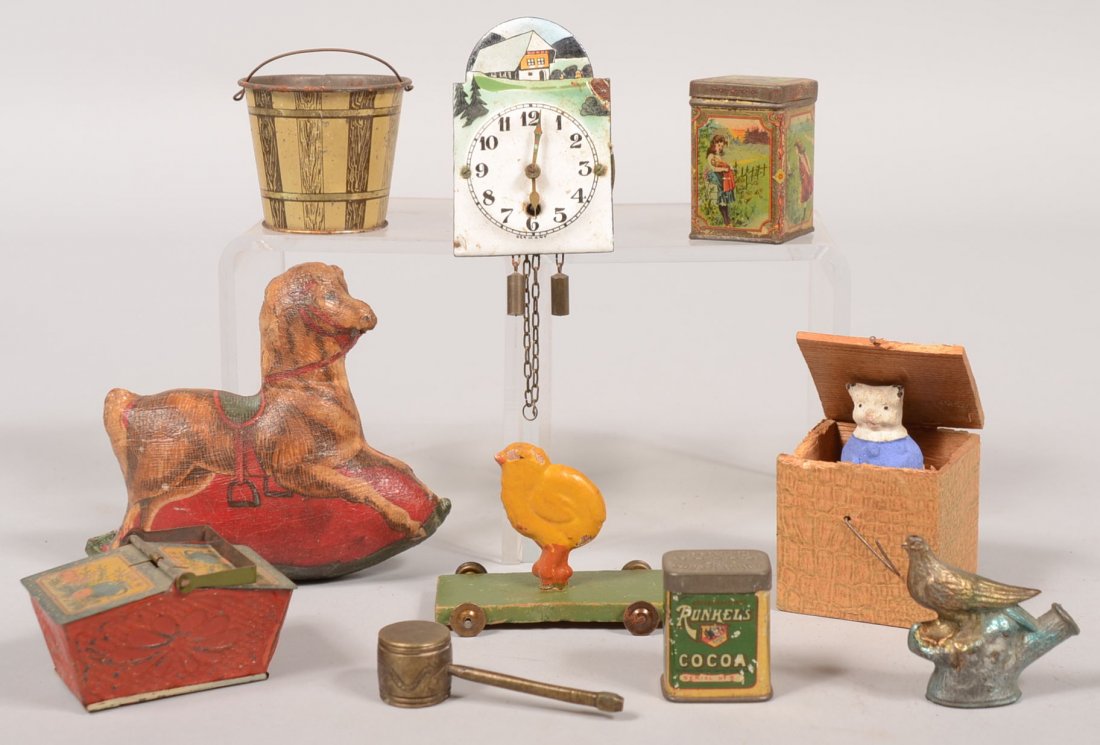 A Group of Small Toys. Two square store tins, Runkel Br: A Group of Small Toys. Two square store tins, Runkel Bros. Cocoa, green litho on gold1 1/2"h.; a tea tin with litho illustrations of children, 2"h.; twin lid picnic basket of pressed and litho illustr