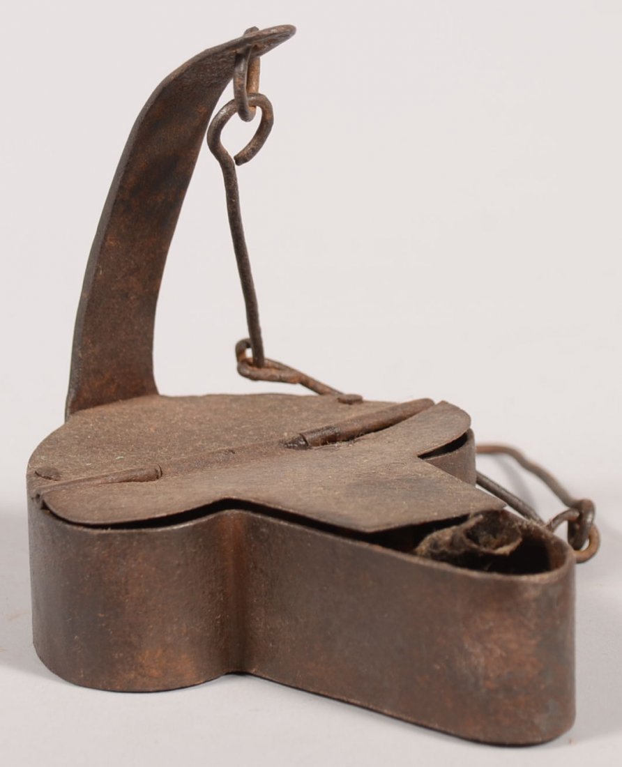 Hanging Boxed "Betty" Type Fat Lamp. Spade shaped sheet: Hanging Boxed "Betty" Type Fat Lamp. Spade shaped sheet iron boxed font with wick tongue and hinged cover having a curved back strap with long link wire hanging chain. 3 3/4"h. X 4 1/2"l. Condition: G