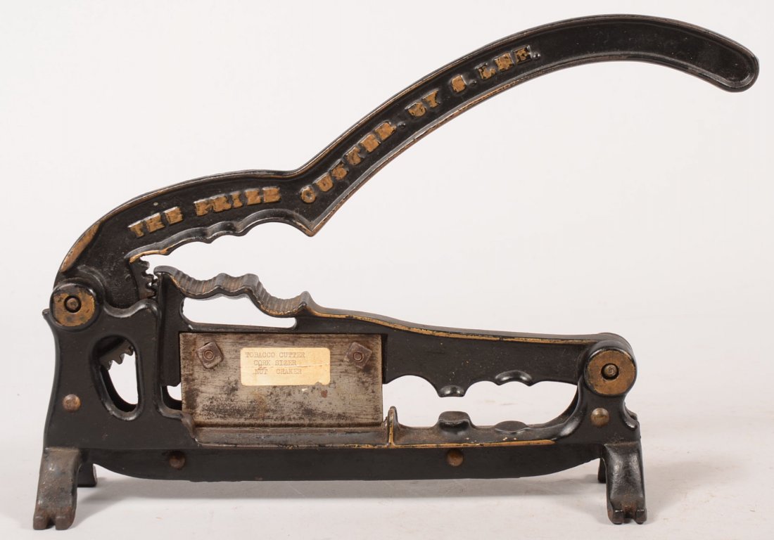 "The Prize Cutter" Deck Mount Cast Iron Cutter/Press. M: "The Prize Cutter" Deck Mount Cast Iron Cutter/Press. Multi-purpose tool in black paint with gold highlights. Plug tobacco cutter, sugar nipper, nut cracker and cork sizer/ compressor. Surface mount l
