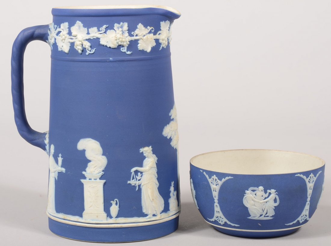 Blue Wedgwood Jasperware Pitcher and Bowl. Straight sid: Blue Wedgwood Jasperware Pitcher and Bowl. Straight sided vessel has raised white Classical Greek female figures with tree and putti on lower body and grapevine around border at rim. Applied twisted s