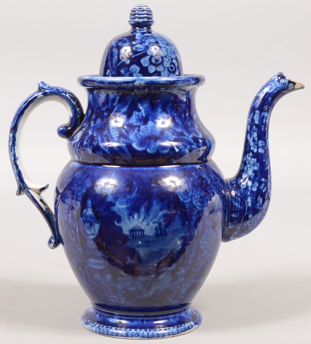 Flow Blue Lafayette at Franklins Tomb Coffee Pot. Raise: Flow Blue Lafayette at Franklins Tomb Coffee Pot. Raised molded foot, bulbous body with goose neck spout, applied molded loop handle and a domed lid with beehive finial. 11 3/4"h. Condition: Spout mou