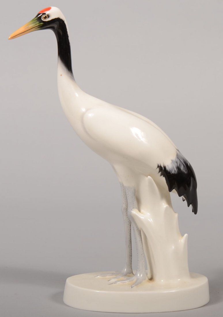 Noritake Bone China Stork Figurine. Casting appears to : Noritake Bone China Stork Figurine. Casting appears to be of a White or Oriental stork mounted on an oval base with a tree stump support. Marked on bottom: "Nippon Toki Kaisha." 10 5/8"h. Condition: G