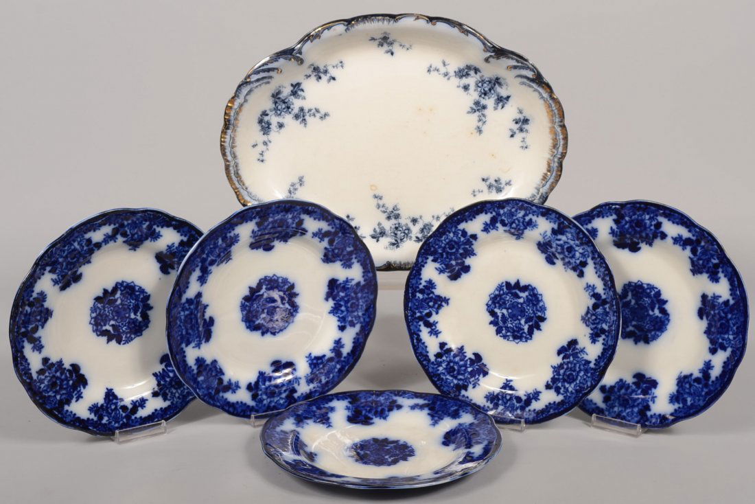 Flow Blue Meat Platter with Five Plates. Oval platter i: Flow Blue Meat Platter with Five Plates. Oval platter in the "Chiswick" pattern by Ridgways. Gilt highlighted scalloped rim. 13 7/8"l. X 10 1/2"w. Together with five "Waldorf" pattern plates with scal