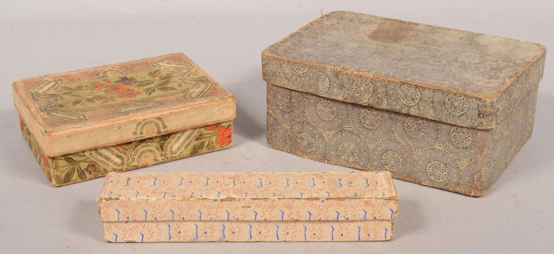 Three Smaller Wall Paper Covered Boxes. A rectangular b: Three Smaller Wall Paper Covered Boxes. A rectangular box with lid in a purple faded to gray paper of medallions with black and yellow fill decoration. 4 1/4"h. X 10"l. X 7"w. A long narrow box covere