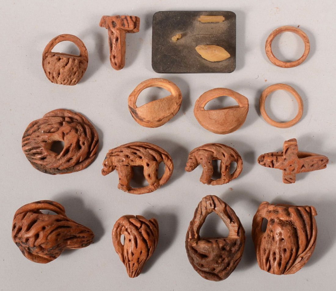 Fifteen Pieces of Carved Peach Pit Folk Art. Shapes inc