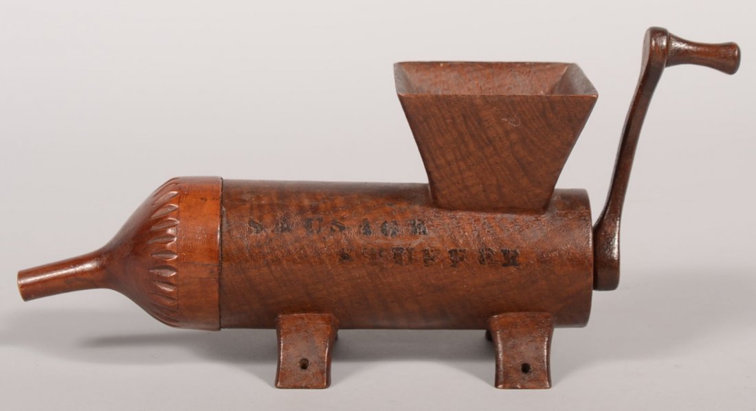 Hand Carved Wood Sausage Stuffer Model. Very neatly car: Hand Carved Wood Sausage Stuffer Model. Very neatly carved wood model of a common utilitarian object found in Central PA. Cylindrical body of dark stained curly maple with an inverted pyramid shaped f