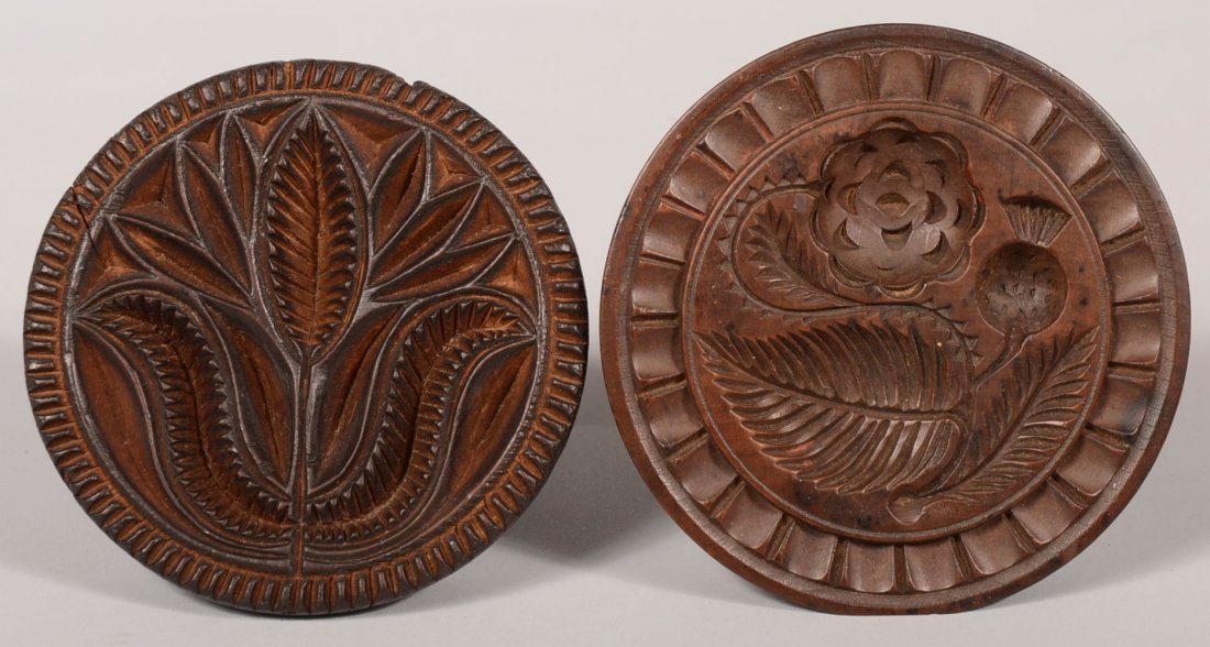Two Carved Round Wood Butter Prints. A thistle and rose: Two Carved Round Wood Butter Prints. A thistle and rose with leaf surrounded by a shield and dart border. 4"dia. Together with a large tulip print with serrated rim. 3 7/8"dia. Condition: Both good wi
