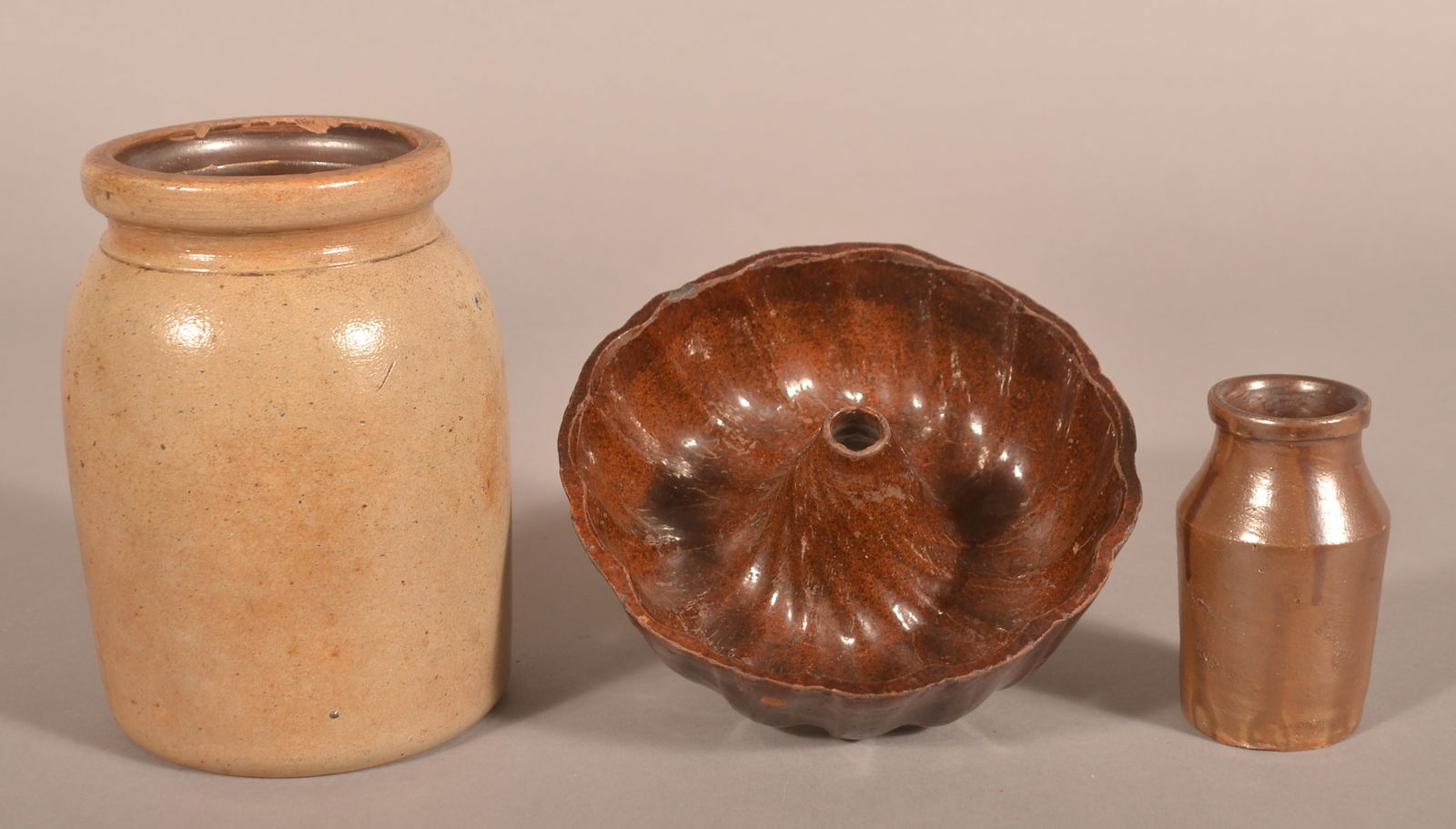 Three Pieces of Glazed Antique Pottery.: Including a redware Turk's mold and two stoneware storage jars. Largest jar, 7-1/2" H x 5" diam.