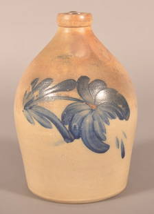 Cowden & Wilcox 1-Gallon Stoneware Jug.: With cobalt blue spitting tulip slip decoration. 11-1/2" H x 6-1/2" diam.