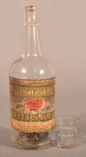 "Bomberger's Pure Rye" Bottle and Shot Glass.: Original paper label "Bomberger's Pure Rye Whiskey". Distilled by H.H. Bomberger, Schaefferstown, PA. And a white enameled fluted shot glass "Bomberger's Pure Rye". 19th century Lebanon County, PA dis