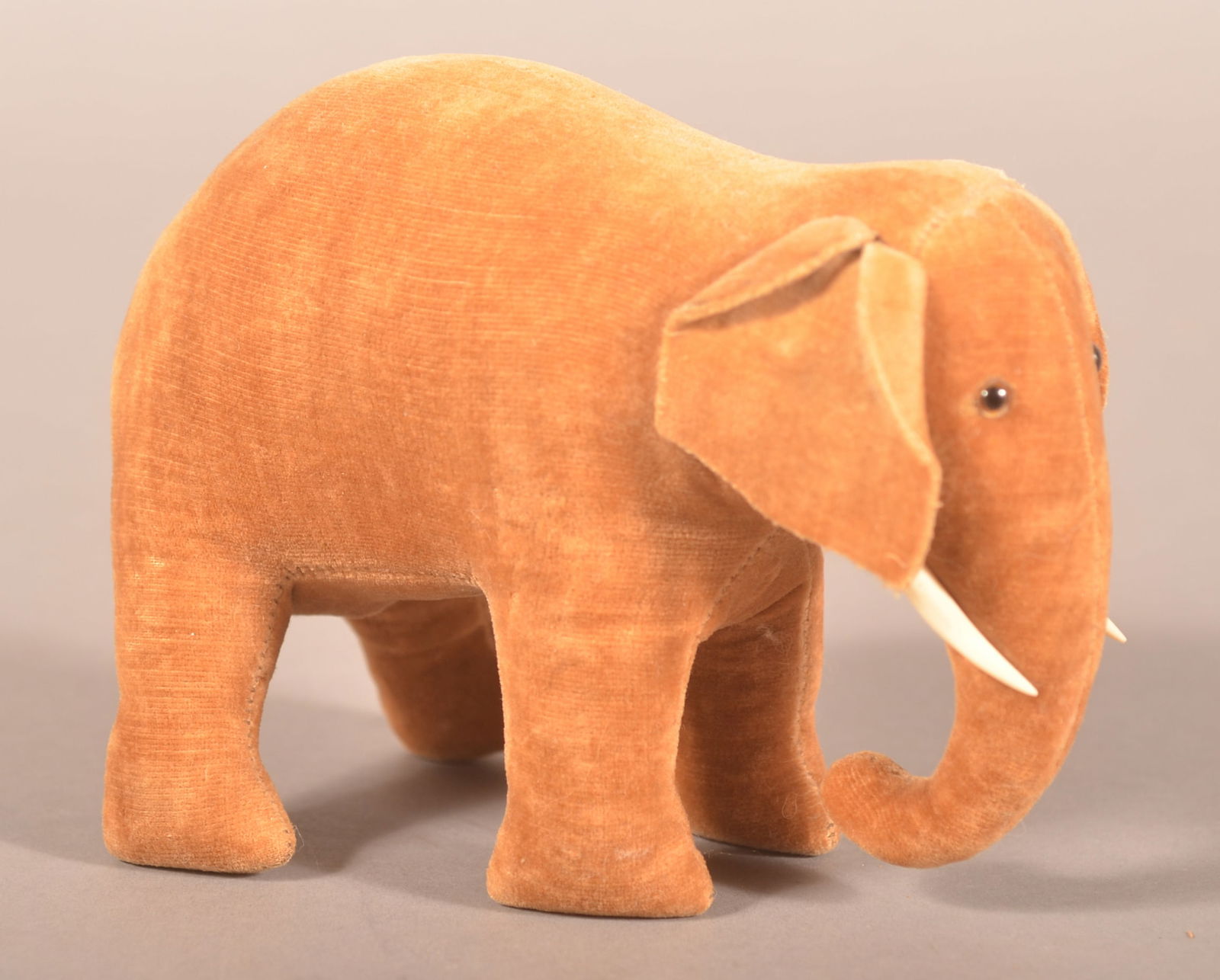 Antique/Vintage Felt Elephant Pin Cushion.: Circa. 1920-1930. With glass eyes and bone tusks. 4-1/2" H x 5-1/2" L x 3" W