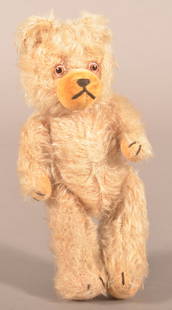 Vintage German Ivory Mohair Teddy Bear.: Attributed to Hermann, circa 1950's. 5-way jointed, glass eyes with black stitched felt muzzle and pads. 8-1/2" H x 3-1/2" W x 2-1/2" D