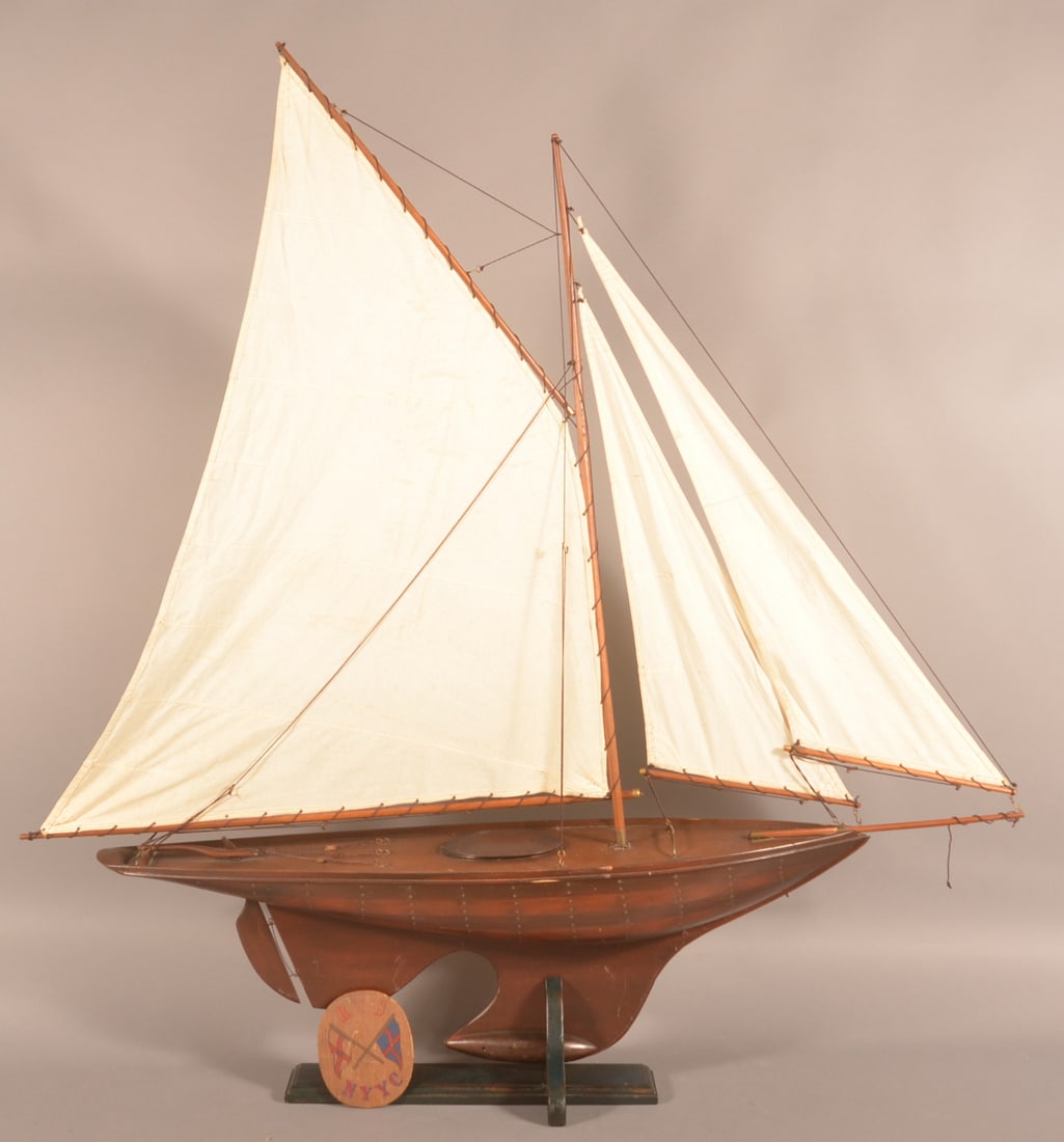 Antique/Vintage Over-Sized Pond Yacht Sailboat.: Laminated mixed-wood hull with original fabric sails. 56" H x (hull) 9" W (base) 12" W x 54" L