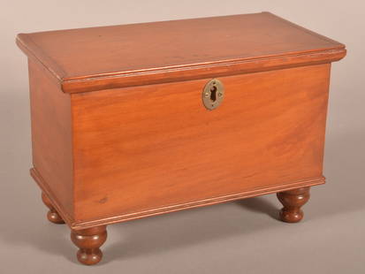 PA Sheraton Cherry Miniature Blanket Chest.: Probably Lancaster County. Molded hinged lid, interior till, dovetailed case, molded base trim and turned feet. 8-1/4" H x 12" W x 5-3/4" D