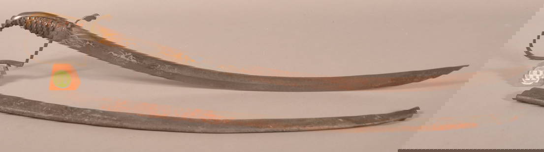 U.S. War of 1812 Brass-Hilted Saber.: Unmarked attributed to Frederick W. Widmann, Philadelphia, PA. Single-edged etched blade with narrow fuller at either side of the spine and acute point. Leather grip intact with grapevine mountings. W