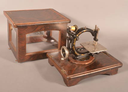 Cased Antique Wilcox & Gibbs Sewing Machine.: Hand-crank mechanism, cast iron with original decoration. Beautiful antique burl mahogany custom-made case. 14" H x 13" W x 15" D