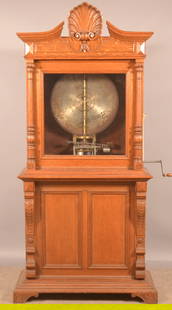 Symphonion 19" Disc Player Music Box.: Carved and molded quarter-sawn oak case. Appears to be home-crafted. One disc only. 80" H x 39" W x 16" D