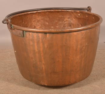 Antique Copper Apple Butter Kettle.: Tampered crimped seams, rolled rim, wrought iron bale handle attached with three copper rivets on rectangular tab. 18-1/2" H x 30-1/2" diam.
