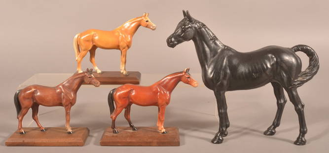 Four Hubley Cast Iron Thoroughbred Horses.: One doorstop and three desk accessories mounted on mahogany bases. Doorstop, 10" H x 11-1/2" L x 3" W Desk accessories, 5-3/4" H x 7" L x 3" W.