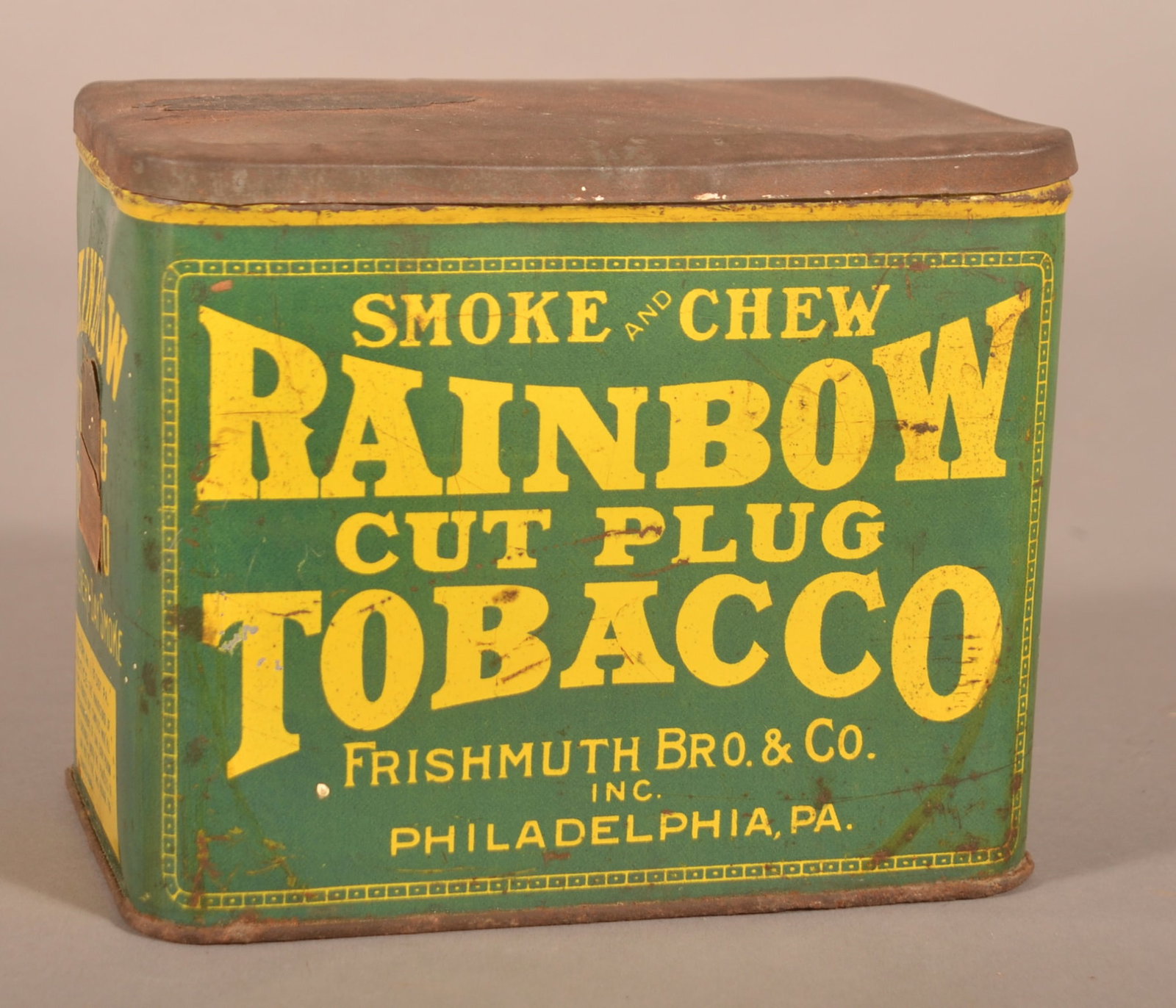 Frishmuth's Rainbow Cut Plug Tobacco Tin.: A nice, rare find from the Frishmuth's company in Philadelphia. 5" H x 6-1/8" W x 3-7/8" D