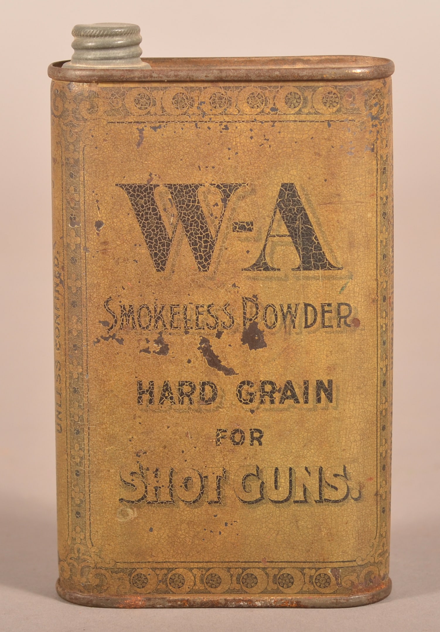 W-A Smokeless Powder Hard Grain Shot Gun Flask.: Made by Laflin & Rand Powder Co from NY. Early lithographed tin with added paper instruction label on reverse side. 5-3/4" H x 3-3/8" W x 1-1/8" D