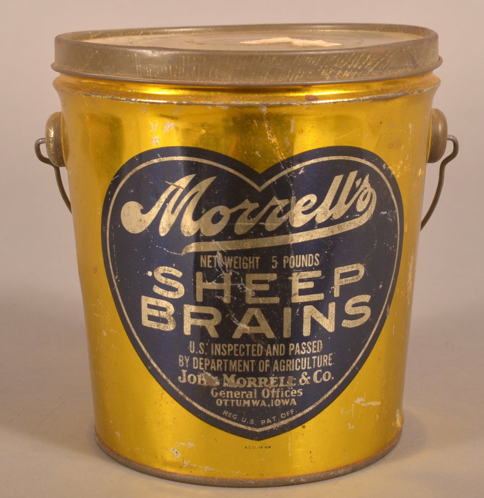 5 lb. Tin Morrell's Sheep Brains Tin, Ottumwa, IA.: Radar O'Reilly wasn't the only thing that came from Ottumwa. Bail handled, nice logo with blue heart and lettering. Not sure if these were served cold or warmed. 6-1/2" H x 5" W