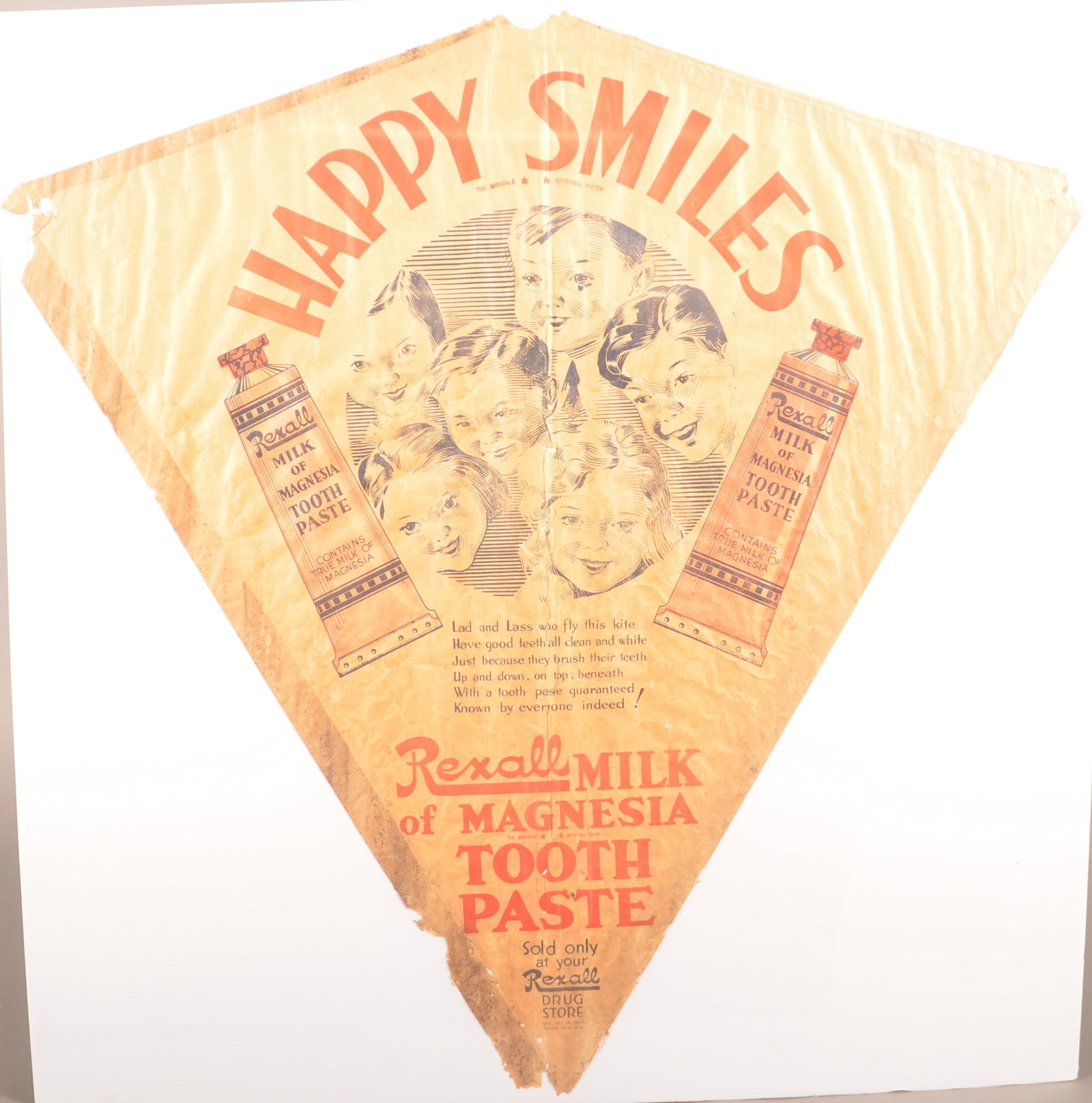 "Happy Smiles" Rexall Milk of Magnesia Kite.: Amazing survivor. Ca. 1930s. Given away to kids to fly. Made of paper, so many couldn't have survived. 34" H x 33-1/2" W