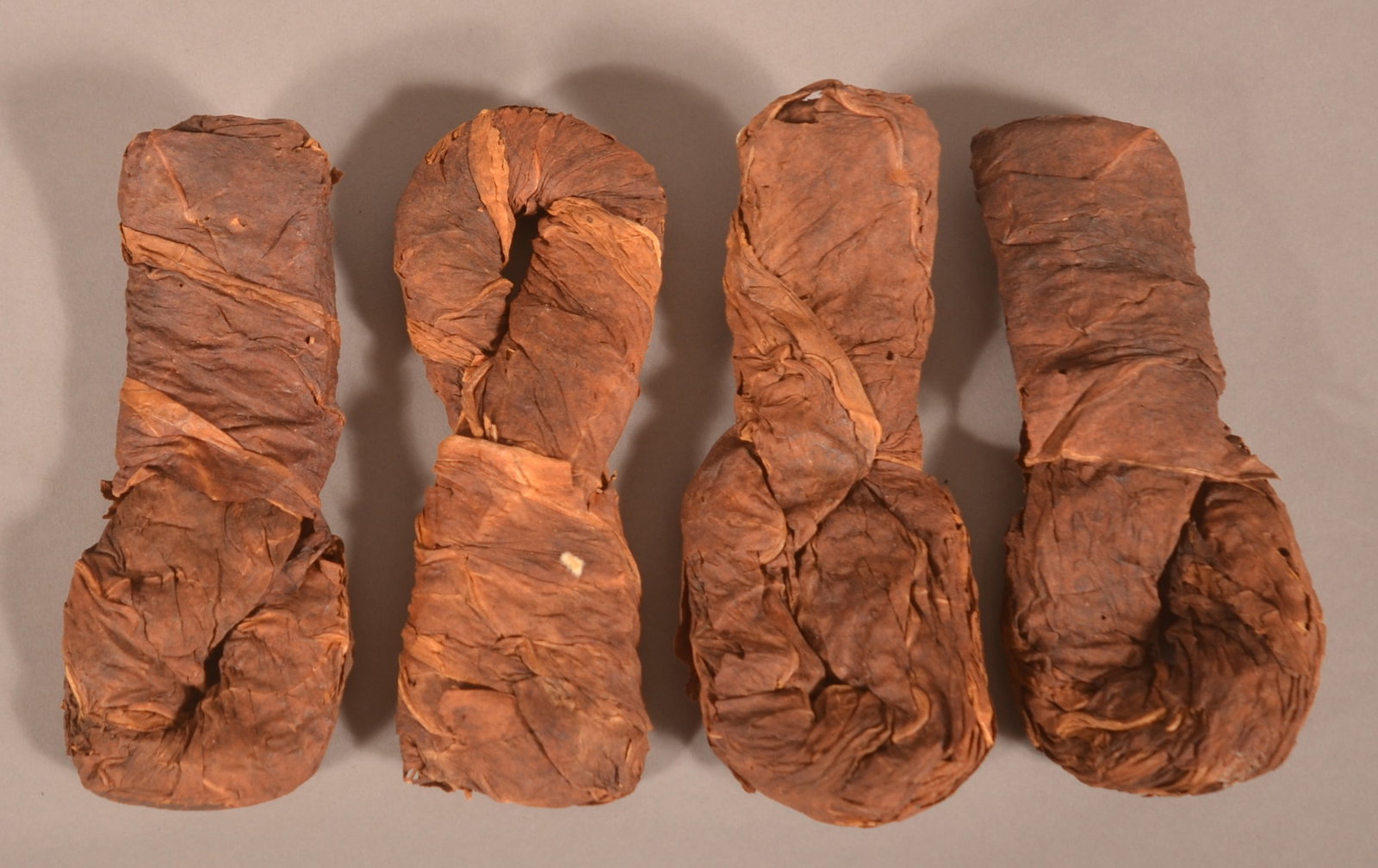 Four Ca. 1890 Twist Plugs of Chewing Tobacco.: Discovered here in central Pennsylvania. Type found in the early buckets or tins of tobacco. 5-3/4" H x 2-1/2" L