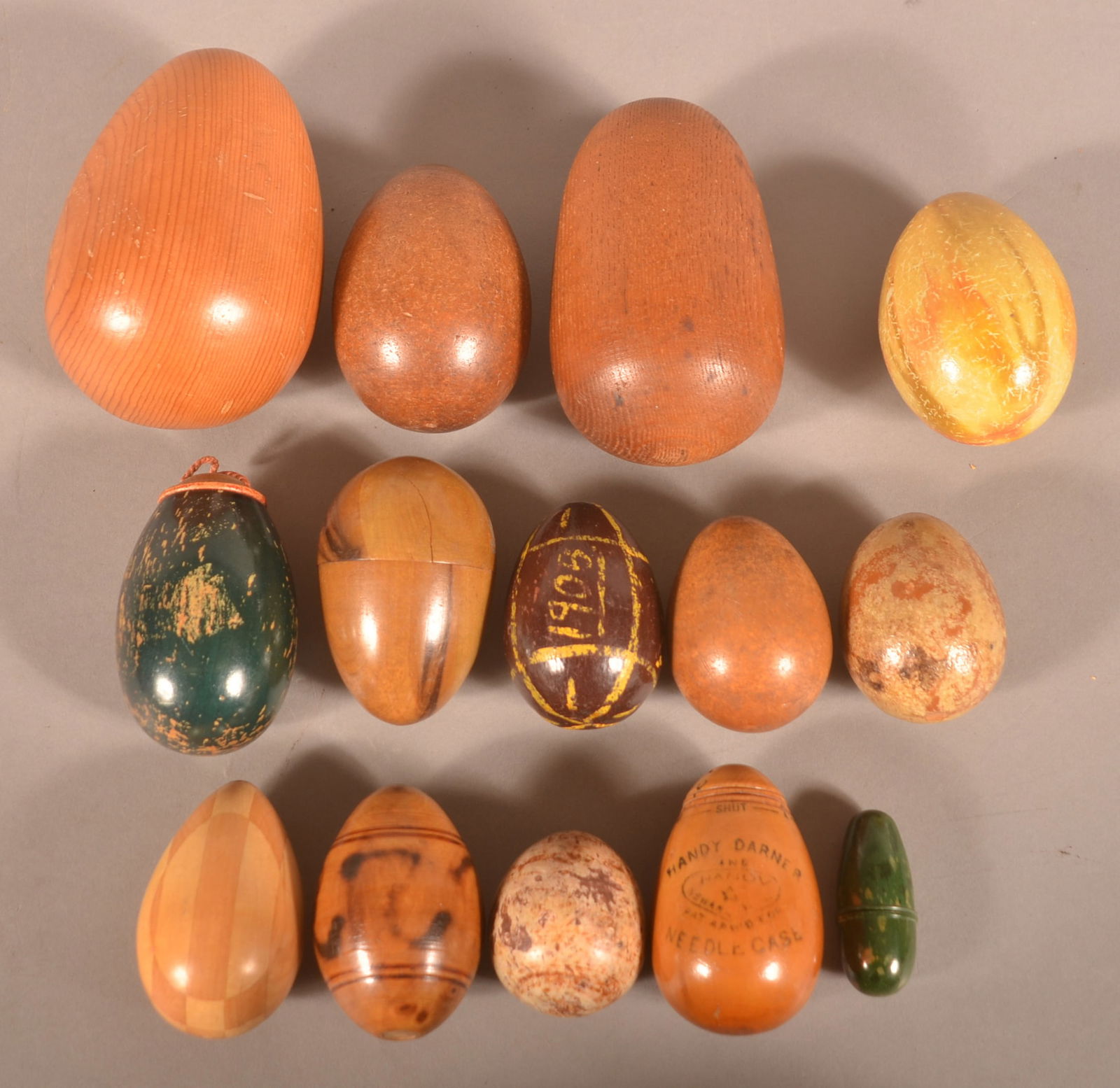 Lot of Various Antique Wooden Eggs.: Including painted folk art, darners and needle cases. Largest, 4-1/2" x 2-3/4".