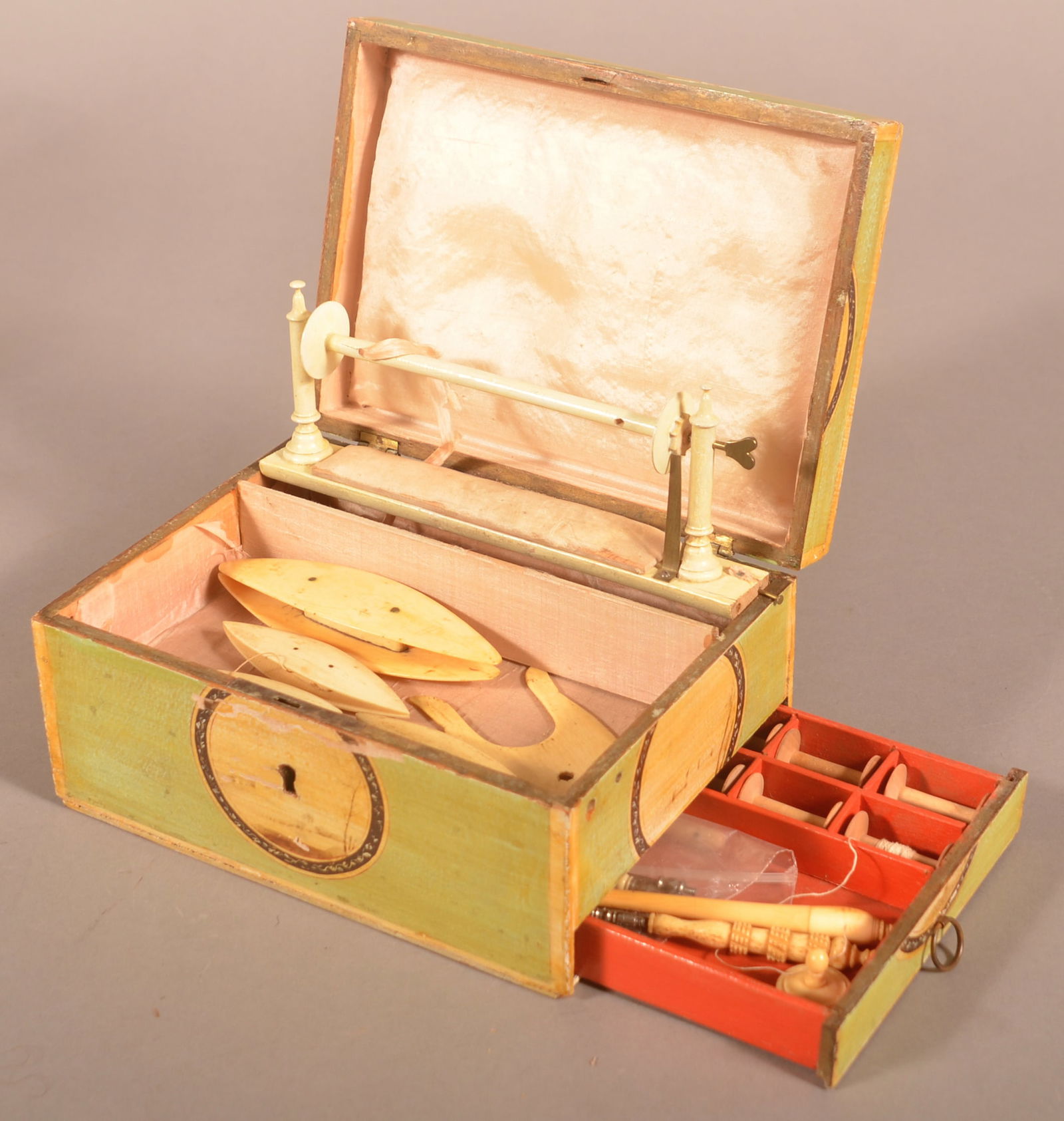 French 19th Century Decorated Netted Lace Box.: Unsigned. Paint decorated with landscape rosettes. Interior with lacing frame and numerous bone accessories. 3-1/2'h. x 7-1/4"w. x 5-3/8"d.