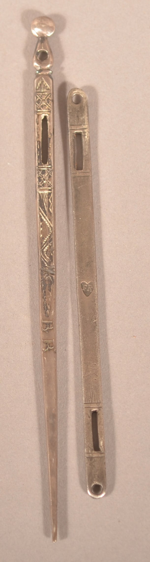 Two English 17th/18th Century Coin Silver Bodkins.: Both have engraved decoration. One hallmarked "FR" in heart, the other hallmarked "IP" in rectangle. 4" and 5"l.