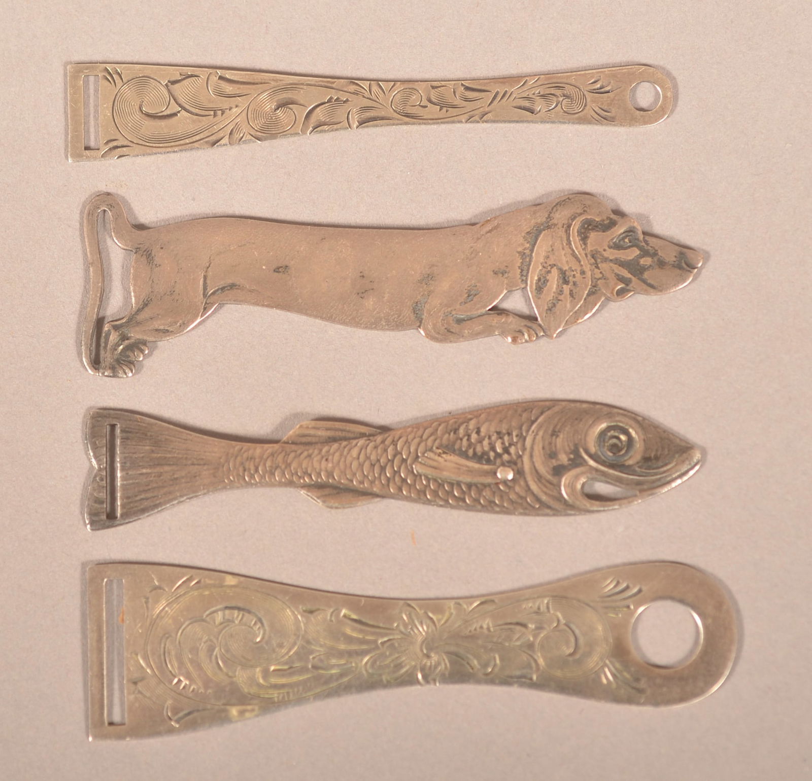 Four American Antique Sterling Ribbon Bodkins.: Including a Simon Brothers fish and a rare dachshund. Longest, 2-3/4".