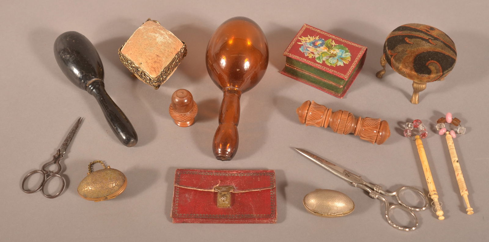 Lot of Antique/Vintage Sewing Accessories.: Including scissors, needle cases, darners, pin cushions, thimble cases and thimbles, sewing kit cases, etc. Amber glass darner, 6-1/2"l.