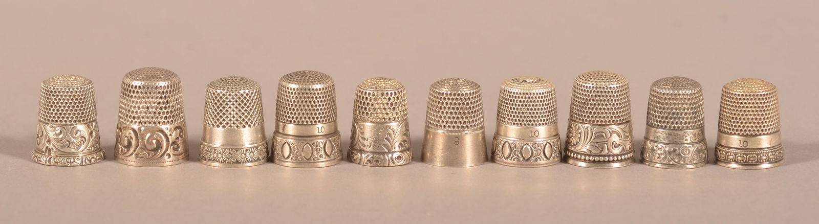 Ten Various Antique/Vintage Sterling Thimbles.: Some with cast or engraved designs. 3/4" to 5/8"h.