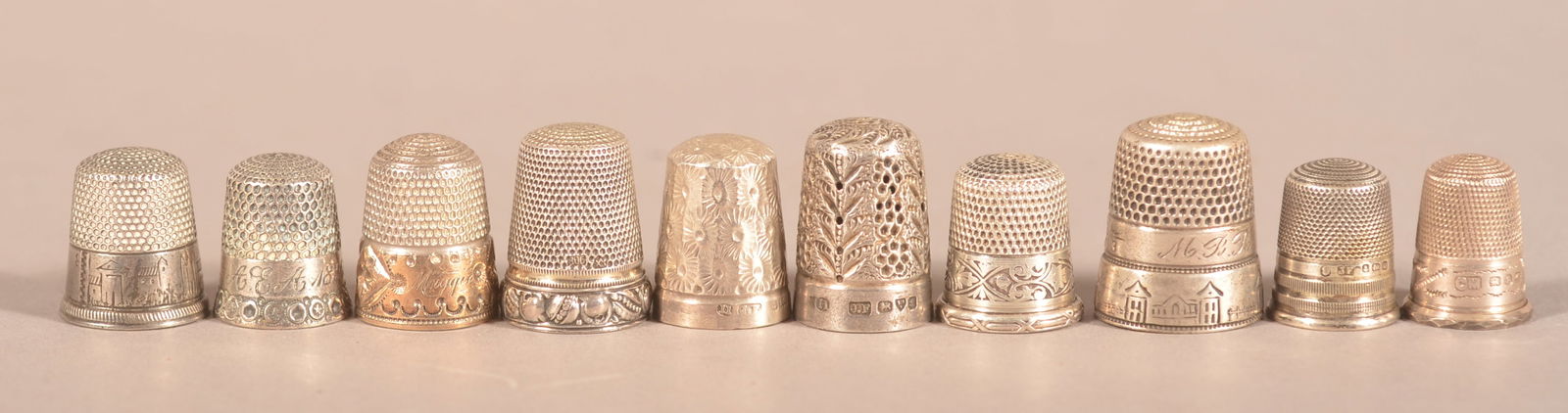 Ten Various Antique/Vintage Silver Thimbles.: Some with cast or engraved designs. 3/4" to 1"h.