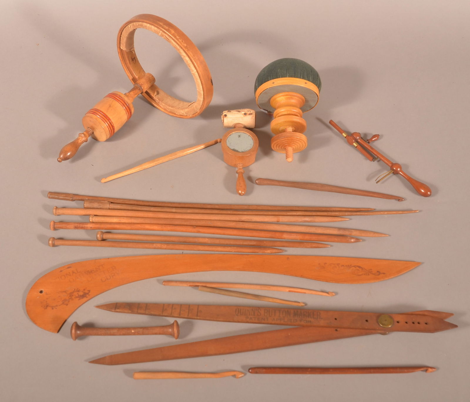 Lot of Antique/Vintage Wooden Sewing Accessories.: Including C-clamp pin cushions and hoop, knitting needles, etc. Garment cutter, 23"l.