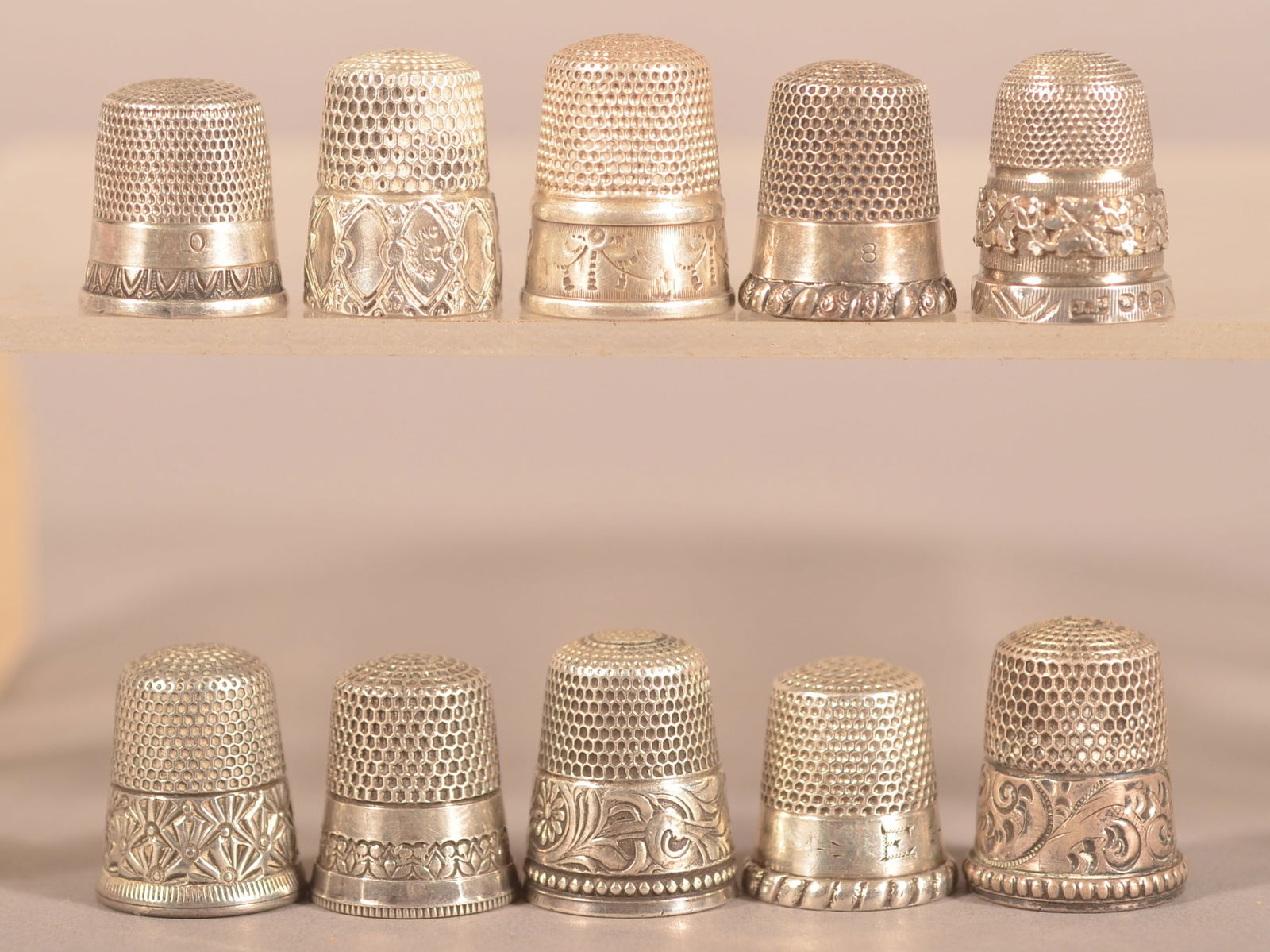 Ten Various Antique/Vintage Sterling Thimbles.: Some with cast or engraved designs. Average 3/4"h.
