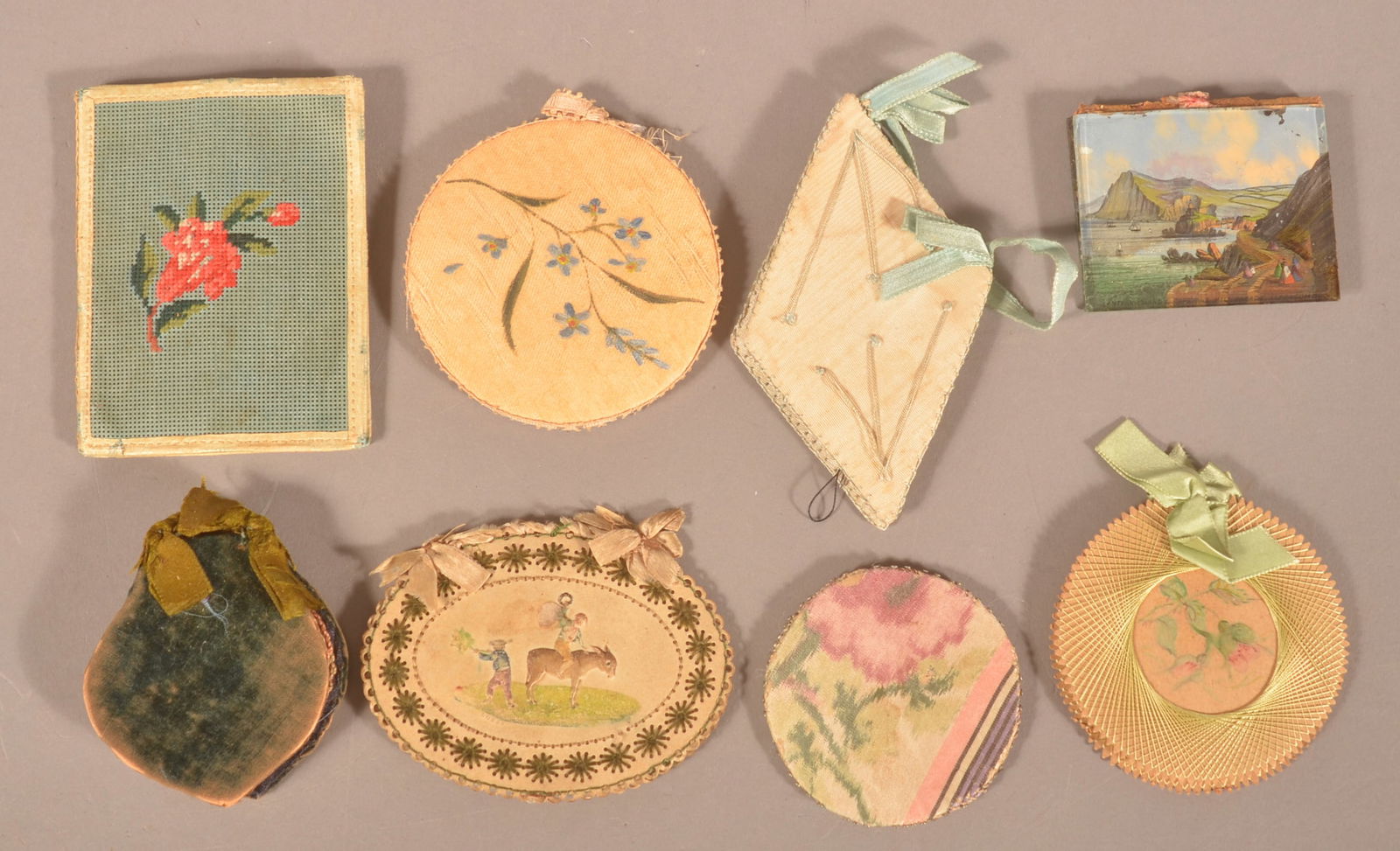 Eight Various 19th Century Needle Cases.: Fabric, punched cardboard and reverse-painted glass. Largest, 3-1/2" x 2-3/4".