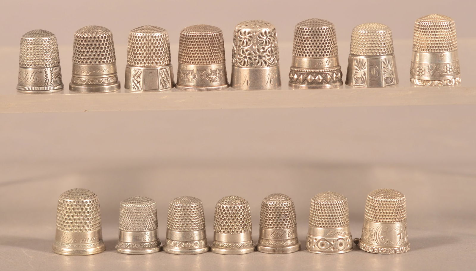 Ten Various Antique/Vintage Silver Thimbles.: Some with cast or engraved designs. 1/2" to 3/4"h.