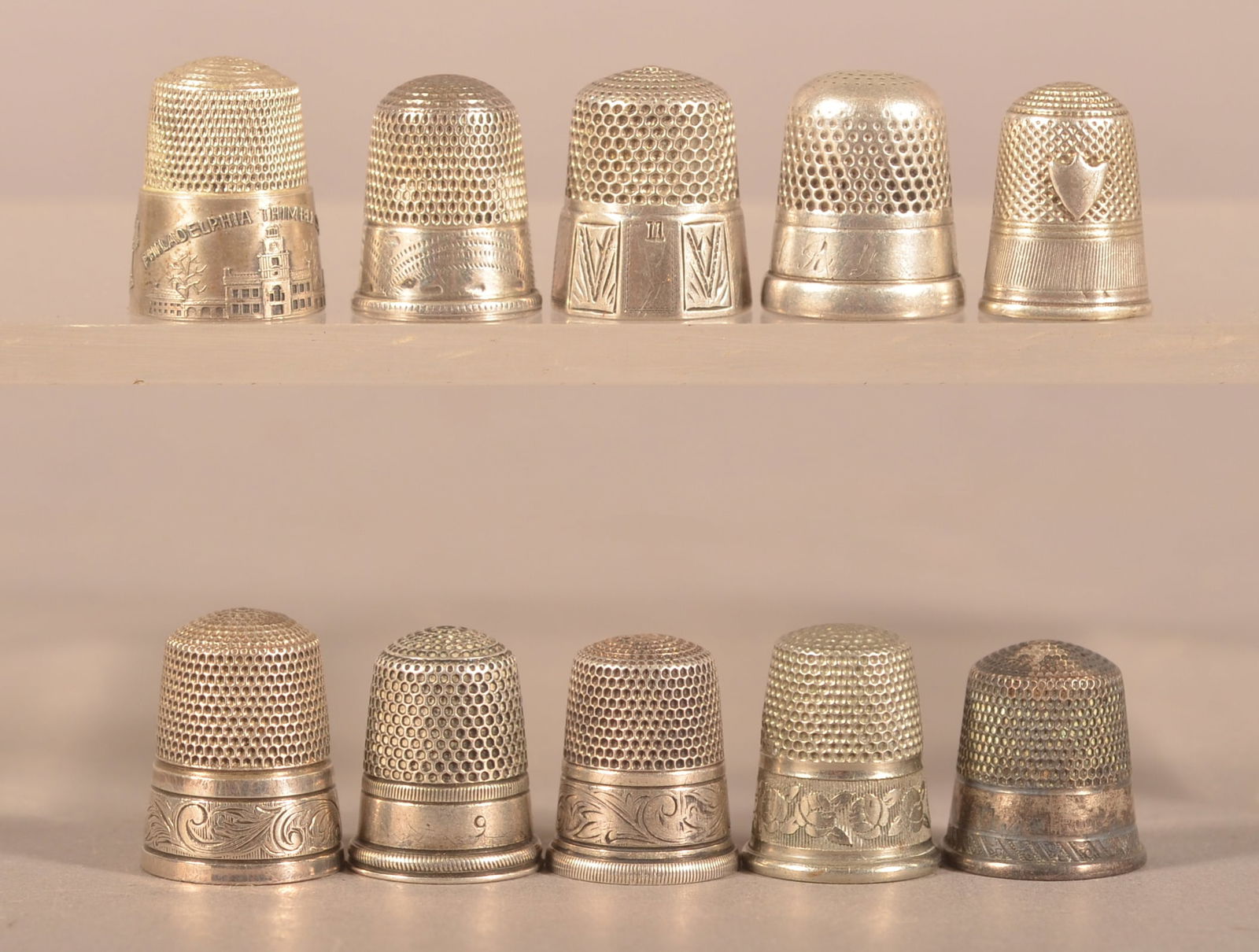 Ten Various Antique/Vintage Silver Thimbles.: Some with cast or engraved designs. Average 3/4"h.