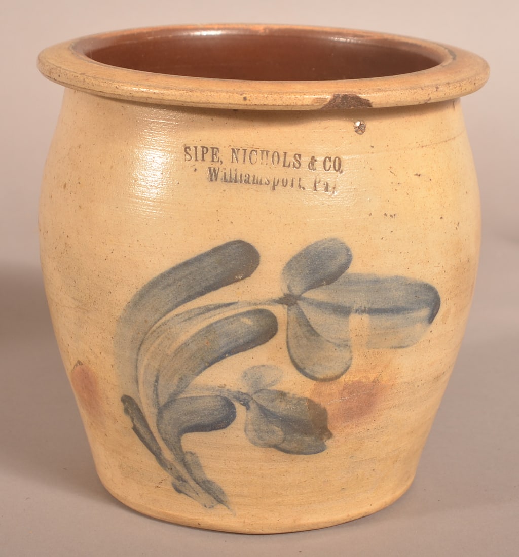 Sipe, Nichols & Co. 1-Gallon Stoneware Cream Jar.: Cobalt blue double tulip bud and foliate slip decoration. Stamped "Sipe, Nichols & Co., Williamsport, PA," circa 1875, ovoid jar with flattened rim. 7-3/4"h. x 7-3/4" diam.