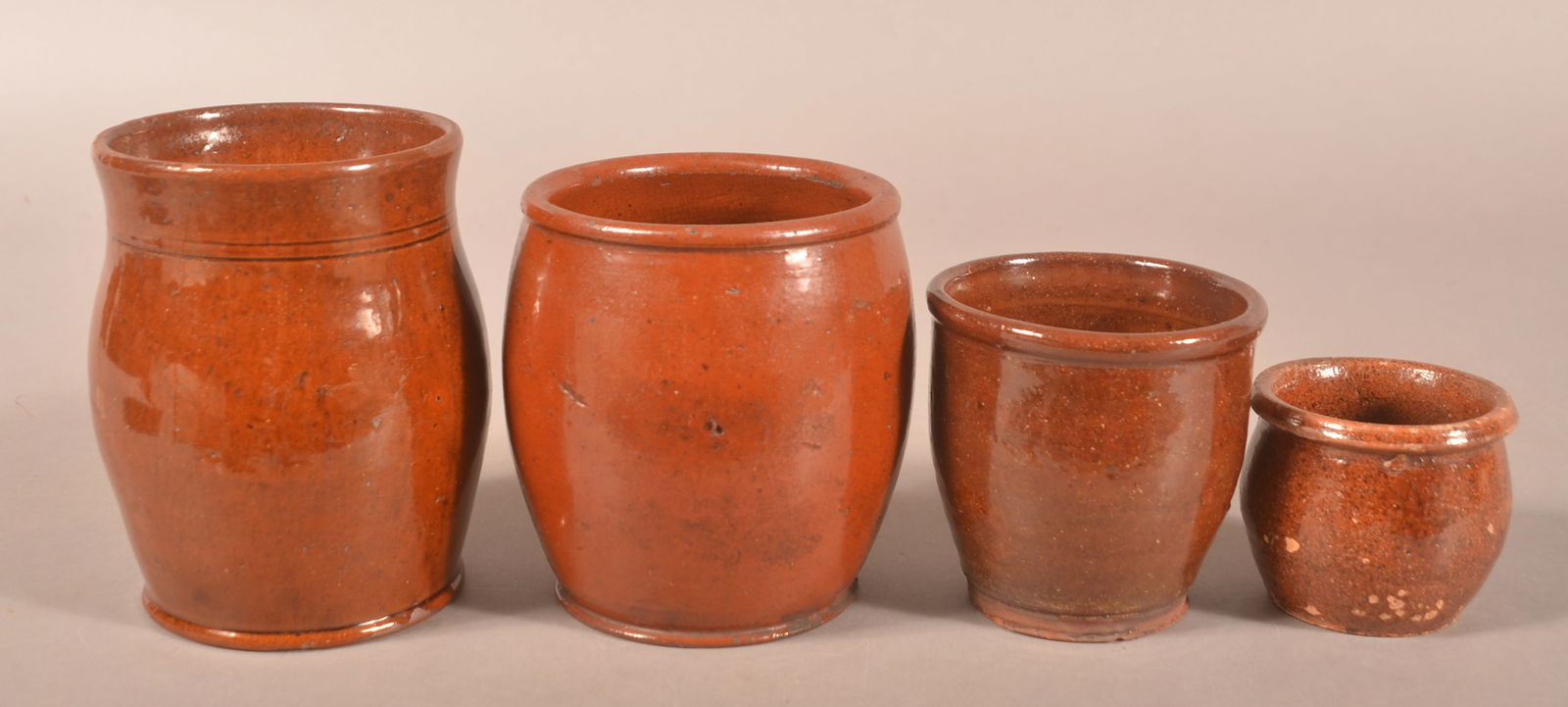 Four PA 19th C. Glazed Redware Storage Jars. (1 of 3)