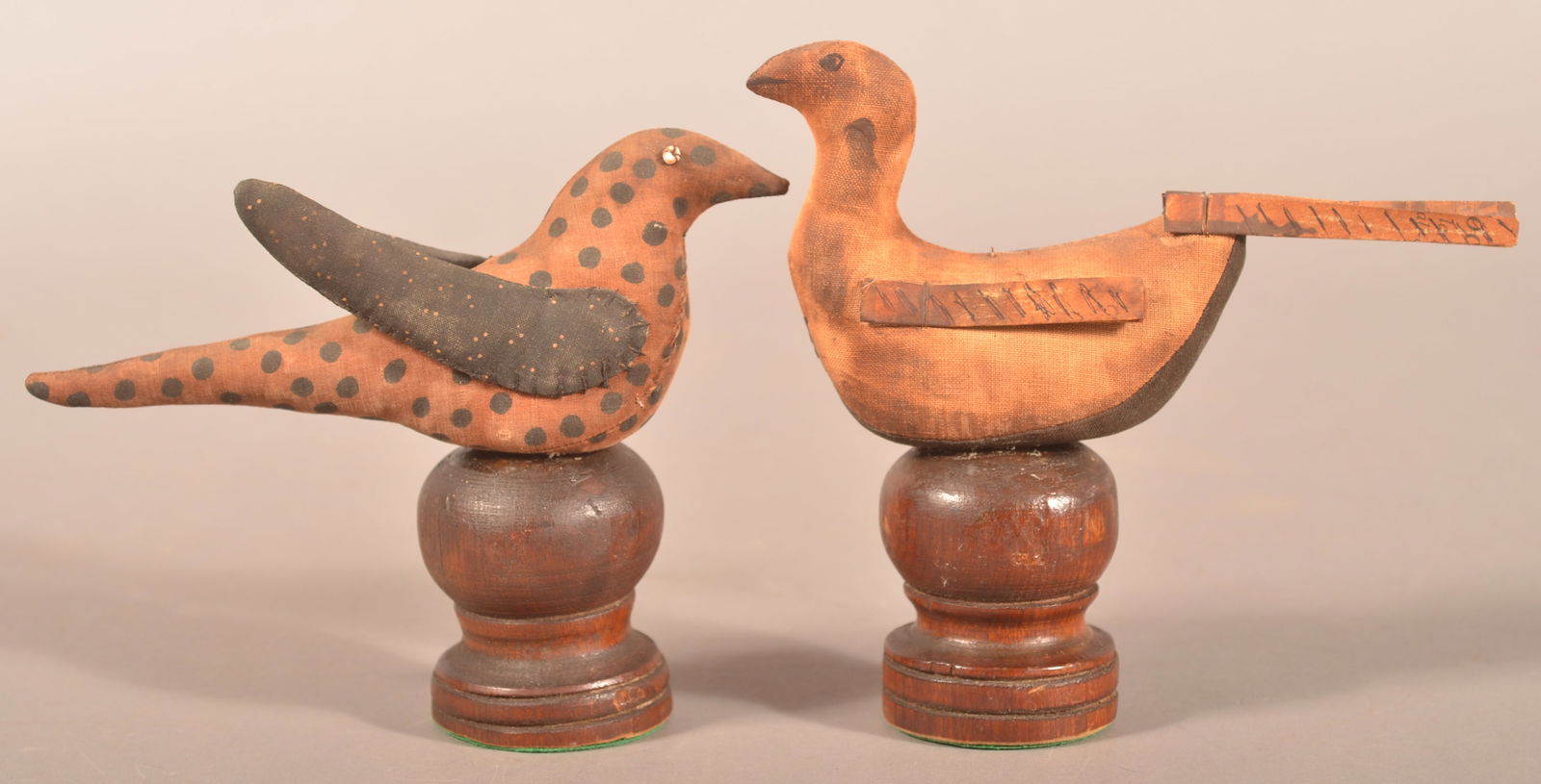 Two 19th C. PA Mennonite Fabric Bird Sculptures.: Possibly pin cushions. Mounted on turned wood pedestal bases. Provenance: Chris Machmer Antiques, Annville, Lebanon County, PA. 6” and 7”h, x 7-3/4"l.