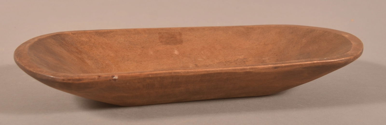 American Mahogany Diminutive Trencher.: Oblong form with tapered sides. 1-3/4”h. x 6”w. x 11-3/4”l.