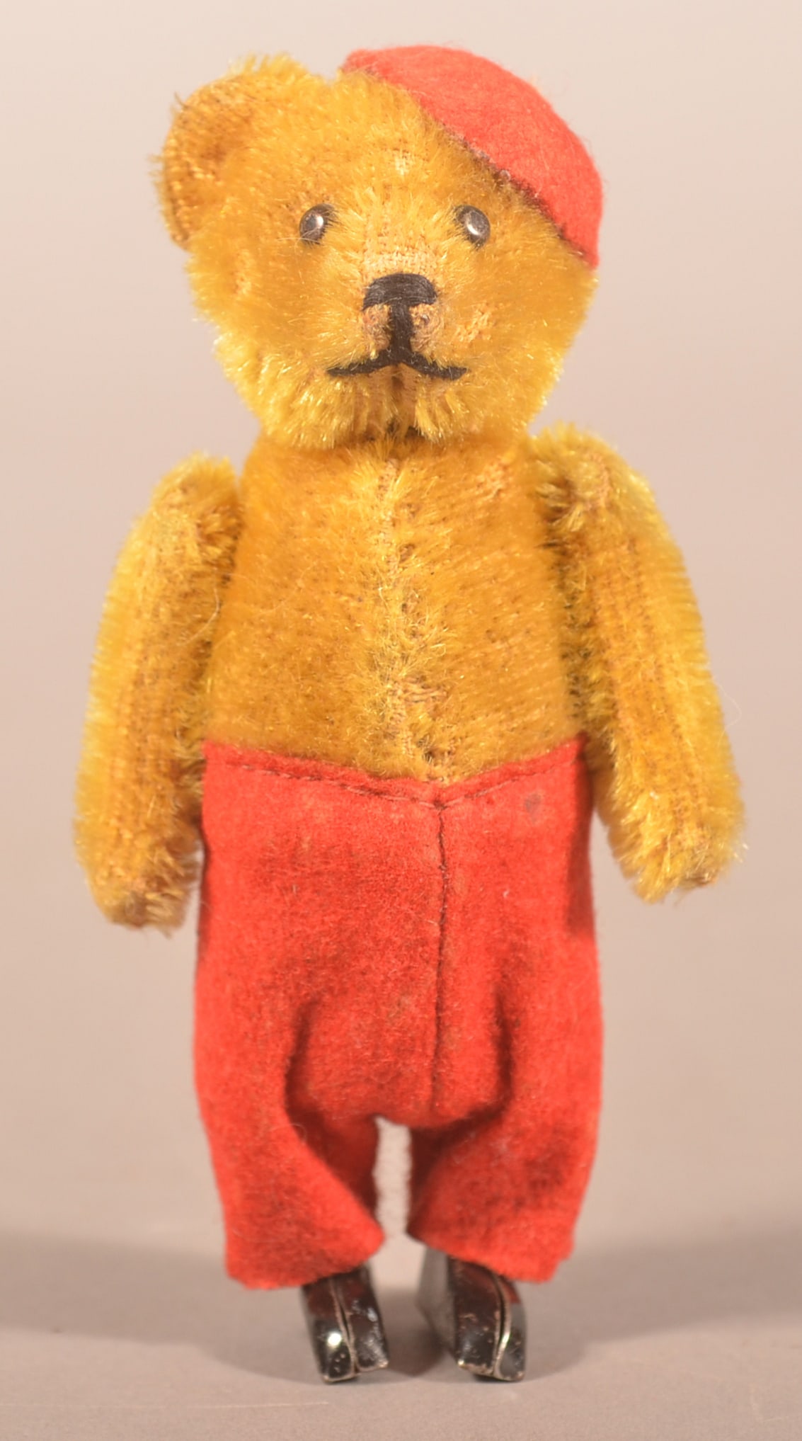 Vintage Schuco 921 Wind-Up Dancing Bear.: Manufactured in Germany 1929, early version with closed feet. Mohair and felt-covered tin, shoe button eyes and black stitched face, bear is wearing a red velvet French beret with tassel. With origina