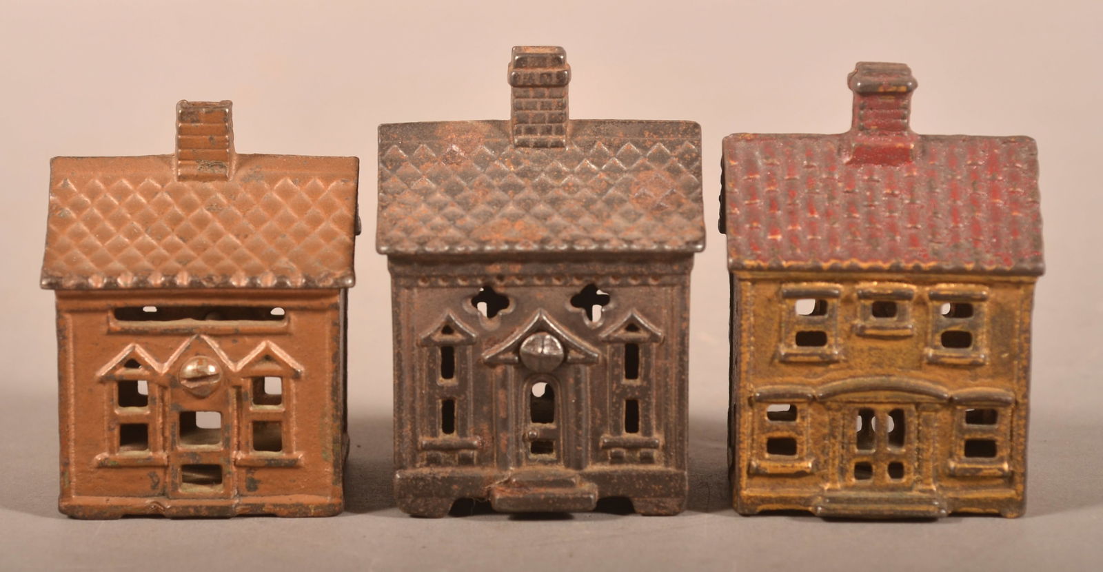 Three Antique Cast Iron Cottage-Form Still Banks. (1 of 4)